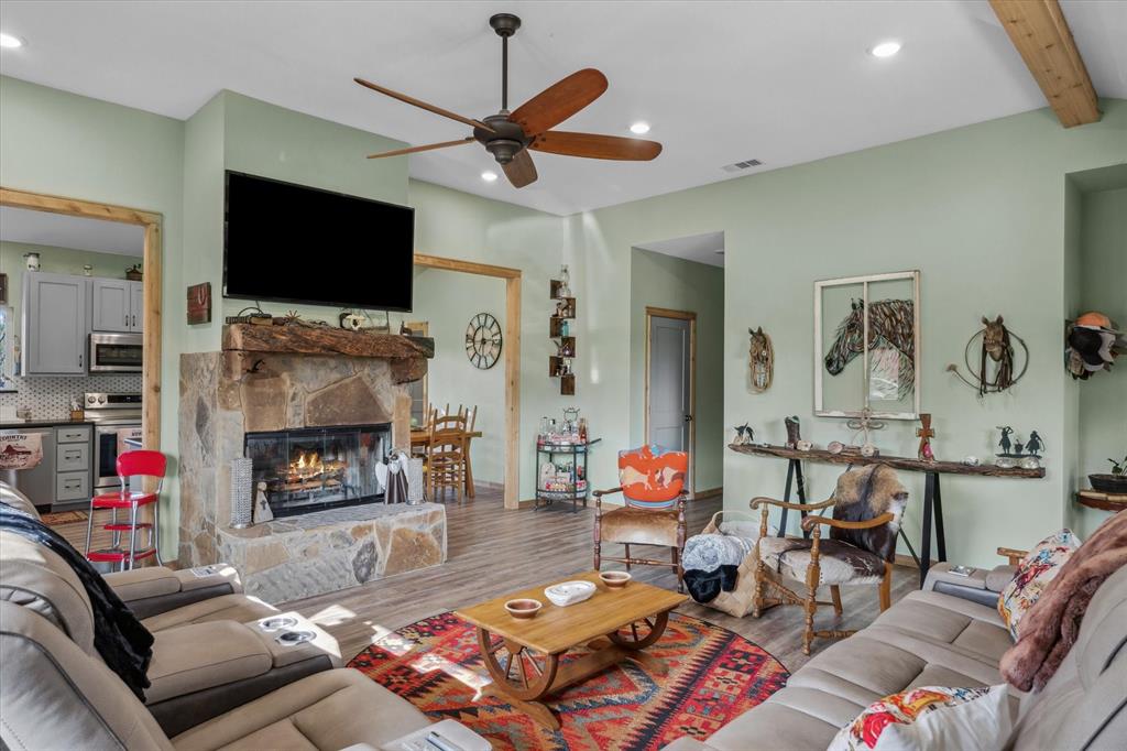 9292 County Road 346 Terrell, TX 75161 - Photo 13 of 40 a living room with fireplace furniture and a flat screen tv
