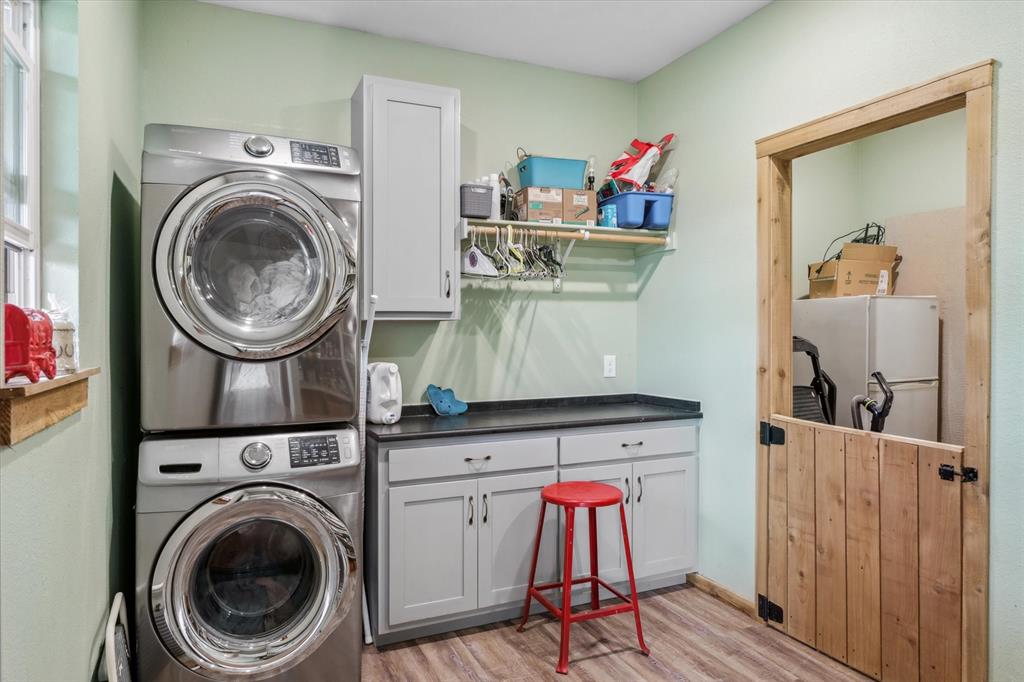 9292 County Road 346 Terrell, TX 75161 - Photo 17 of 40 a view of a storage and utility room with washer and dryer