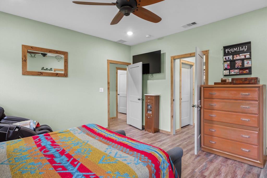 9292 County Road 346 Terrell, TX 75161 - Photo 26 of 40 a bedroom with a bed and a dresser