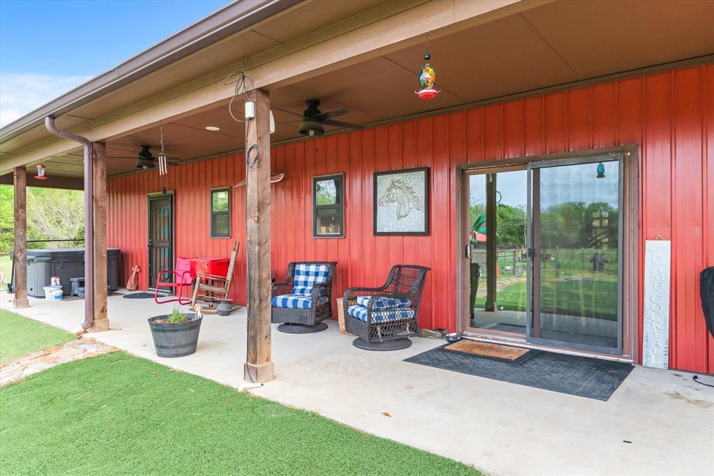 9292 County Road 346 Terrell, TX 75161 - Photo 30 of 40 a view of a patio with table and chairs and floor to ceiling window