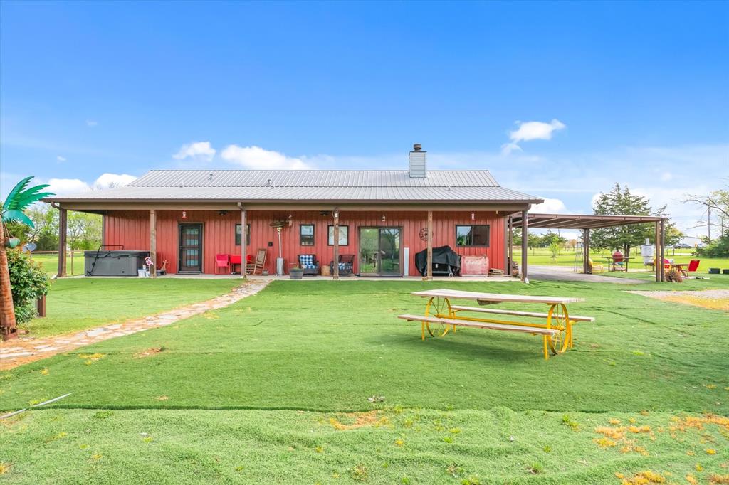9292 County Road 346 Terrell, TX 75161 - Photo 31 of 40 a view of a swimming pool with a yard and a large tree