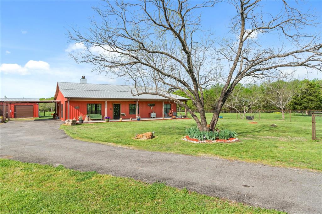 9292 County Road 346 Terrell, TX 75161 - Photo 6 of 40 a front view of a house with garden