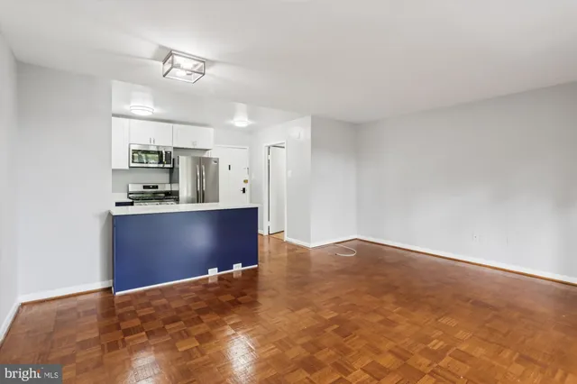 a bathroom with a sink vanity mirror and toilet