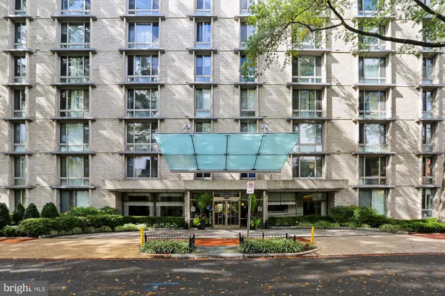 a dining room with furniture and a painting