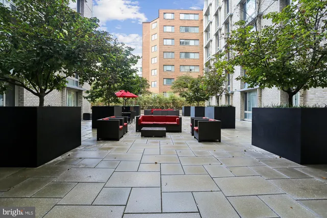 a workspace with furniture and a lamp