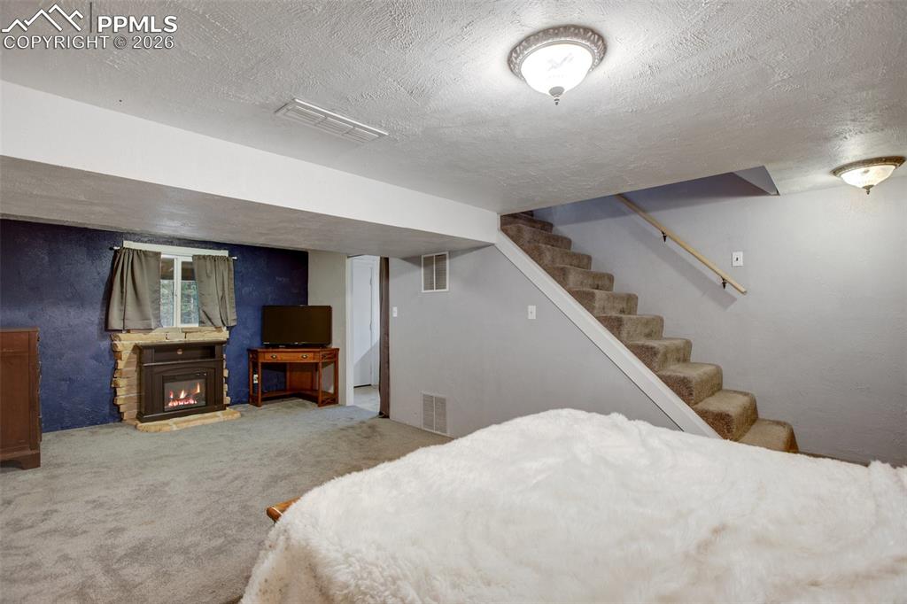 377 Ridge Road Divide, CO 80814 - Photo 32 of 50 a bed room with a bed and a television