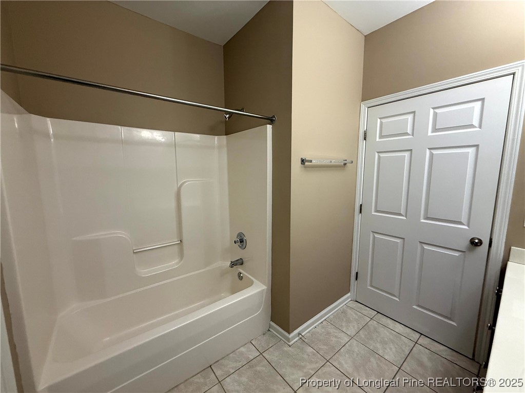 635 Marsh Tree Street, Unit 208 Fayetteville, NC 28314 - Photo 11 of 20 a bathroom with a bathtub and a shower