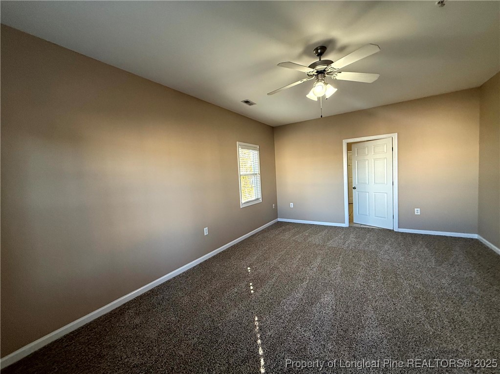 635 Marsh Tree Street, Unit 208 Fayetteville, NC 28314 - Photo 15 of 20 a view of a livingroom with a ceiling fan and window