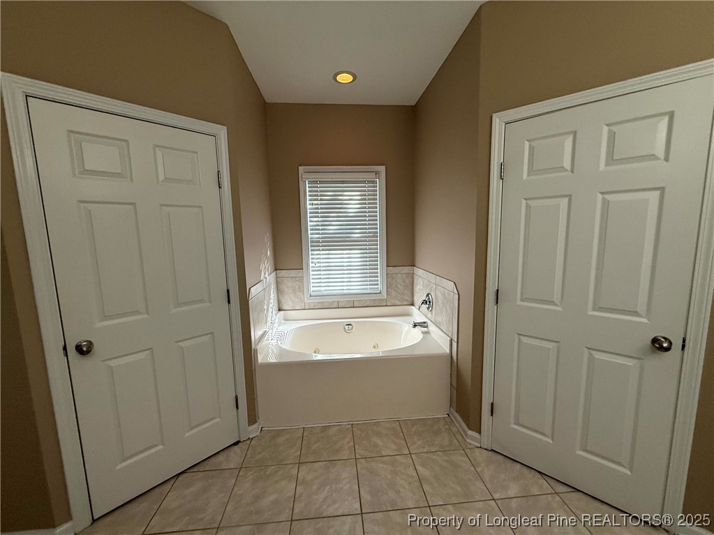 635 Marsh Tree Street, Unit 208 Fayetteville, NC 28314 - Photo 17 of 20 a spacious bathroom with a bathtub and sink