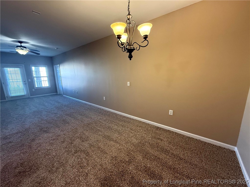 635 Marsh Tree Street, Unit 208 Fayetteville, NC 28314 - Photo 6 of 20 a view of a room with a chandelier