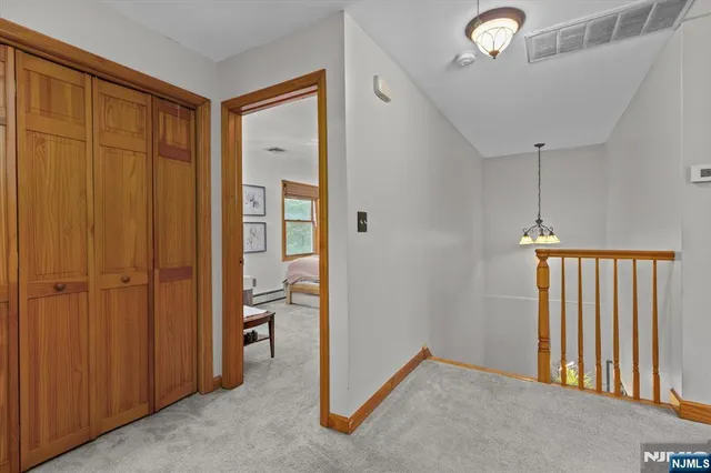 a spacious bedroom with a bed and a window