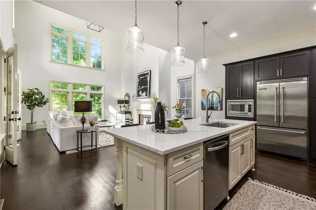 a living room with furniture wooden floor and a large window