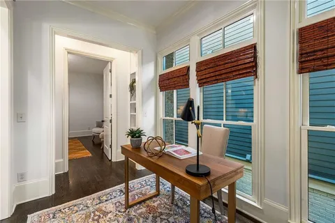 a spacious bathroom with a double vanity sink and a mirror