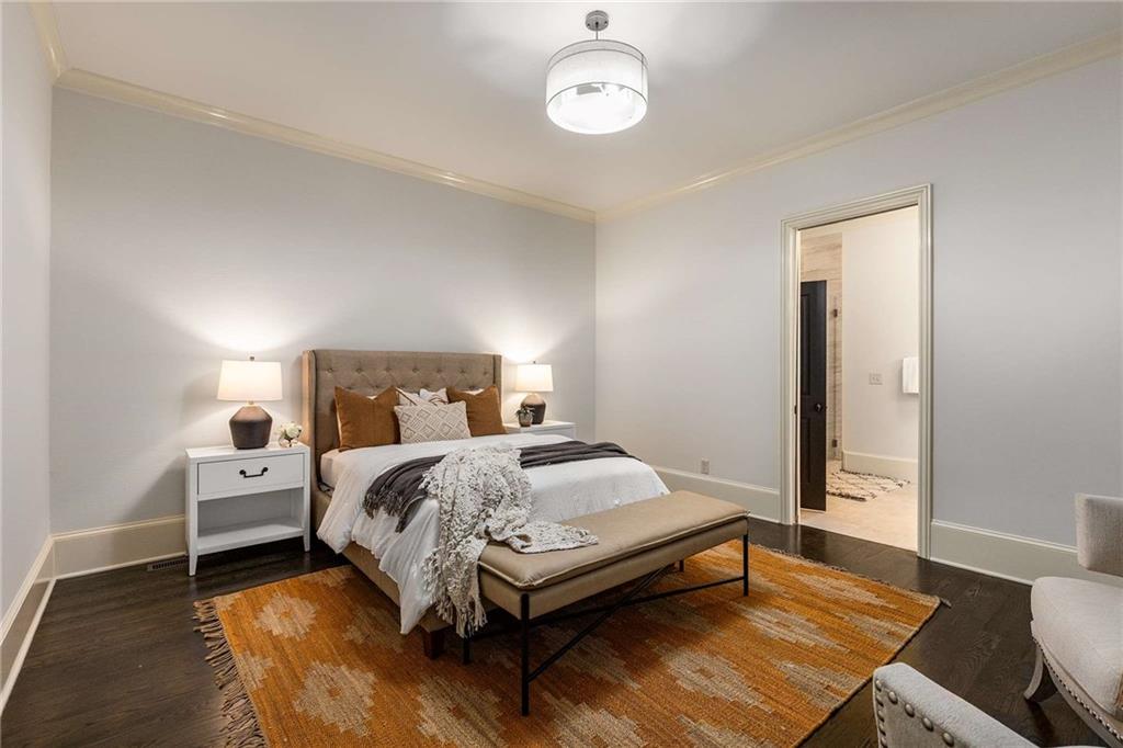 147 Hubbard Road Woodstock, GA 30188 - Photo 24 of 56 a bedroom with a bed and a table in it