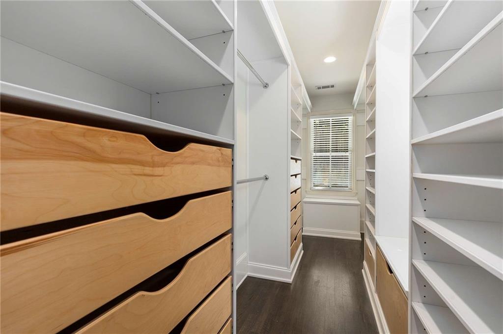 147 Hubbard Road Woodstock, GA 30188 - Photo 28 of 56 a view of walk in closet with empty racks