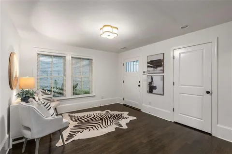 a bathroom with a double vanity sink mirror and shower