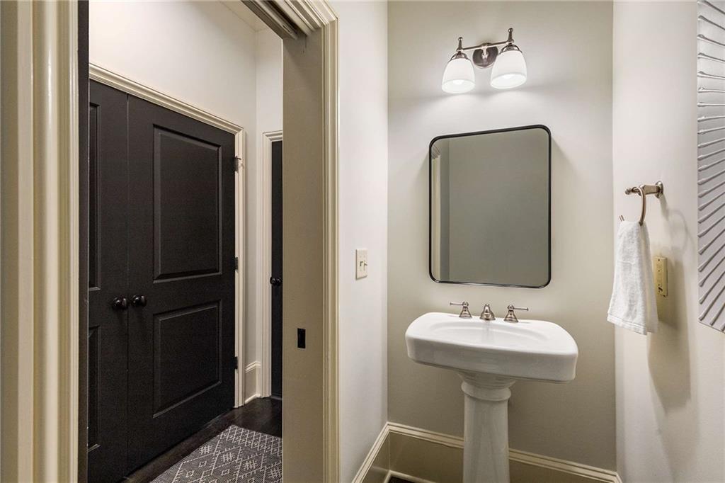 147 Hubbard Road Woodstock, GA 30188 - Photo 36 of 56 a bathroom with a sink and a mirror