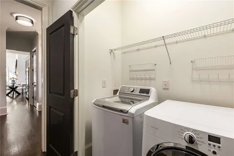 a bedroom with a bed chairs and window