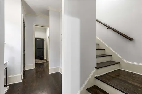 a bathroom with a sink a toilet a mirror a vanity and shower