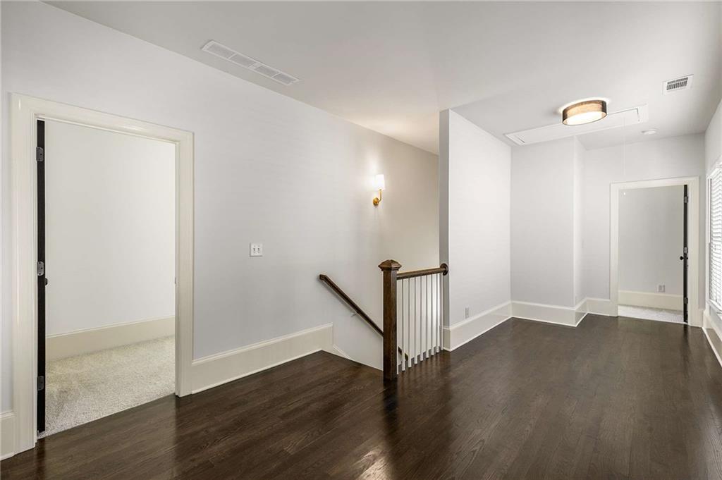 147 Hubbard Road Woodstock, GA 30188 - Photo 40 of 56 an empty room with wooden floor and entrance