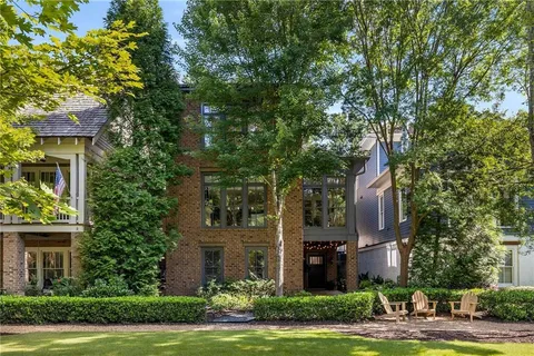 a view of backyard with patio and outdoor seating