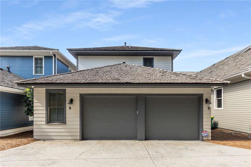 147 Hubbard Road Woodstock, GA 30188 - Photo 45 of 56 a view of a house with garage