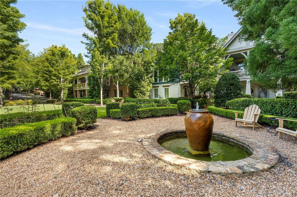 147 Hubbard Road Woodstock, GA 30188 - Photo 56 of 56 a view of a backyard with sitting area and garden