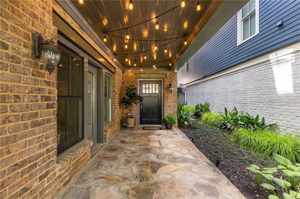 147 Hubbard Road Woodstock, GA 30188 - Photo 9 of 56 a view of a hallway with potted plants