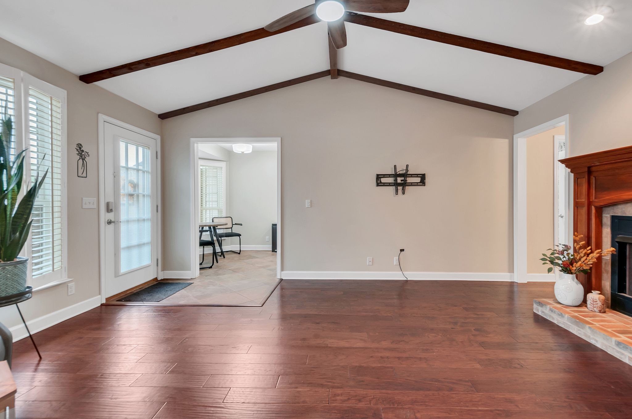 1343 General George Patton Road Nashville, TN 37221 - Photo 15 of 41 a view of a livingroom with wooden floor and a staircase