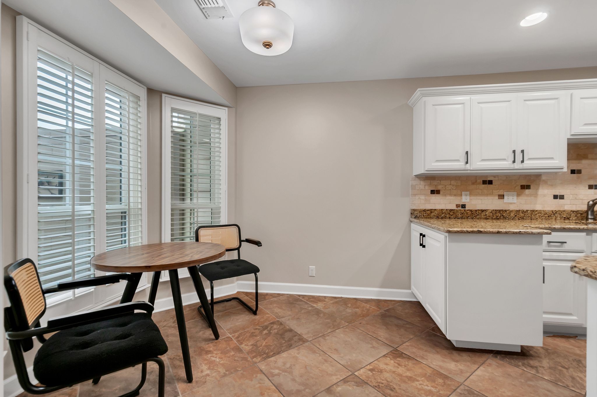 1343 General George Patton Road Nashville, TN 37221 - Photo 20 of 41 a view of a kitchen with granite countertop furniture and a window