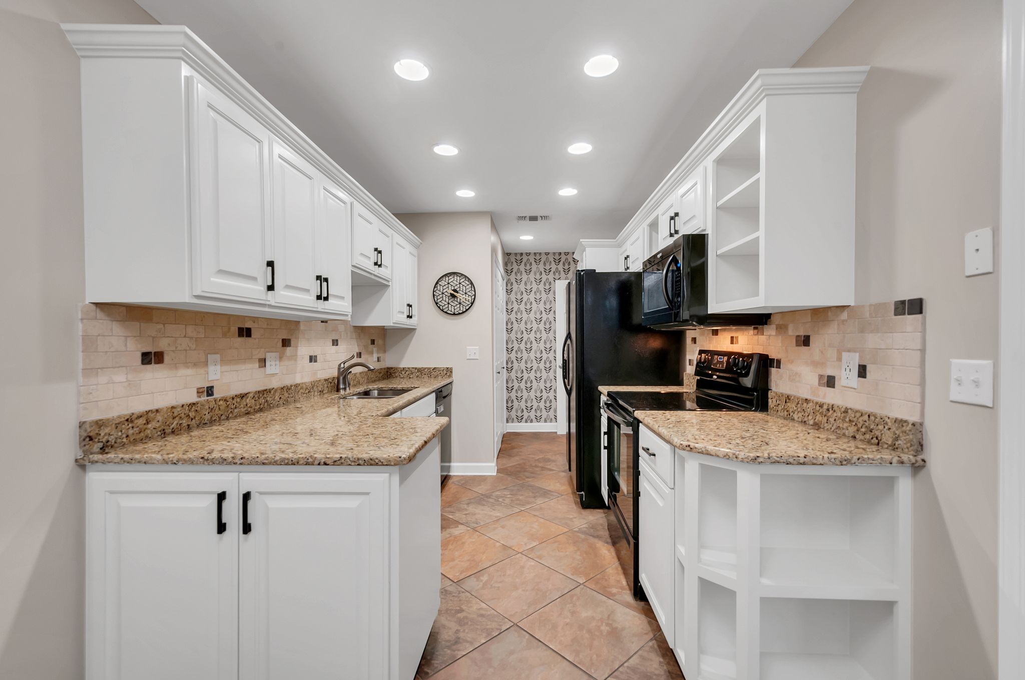 1343 General George Patton Road Nashville, TN 37221 - Photo 21 of 41 a kitchen with stainless steel appliances granite countertop a sink stove and refrigerator