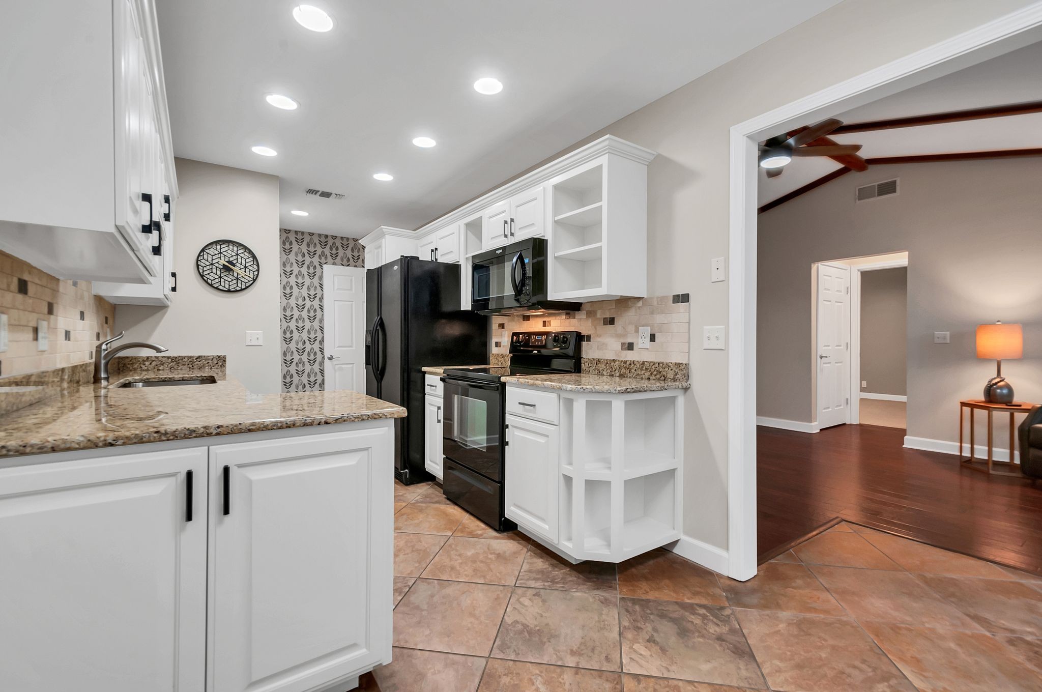 1343 General George Patton Road Nashville, TN 37221 - Photo 22 of 41 a kitchen with white cabinets and refrigerator