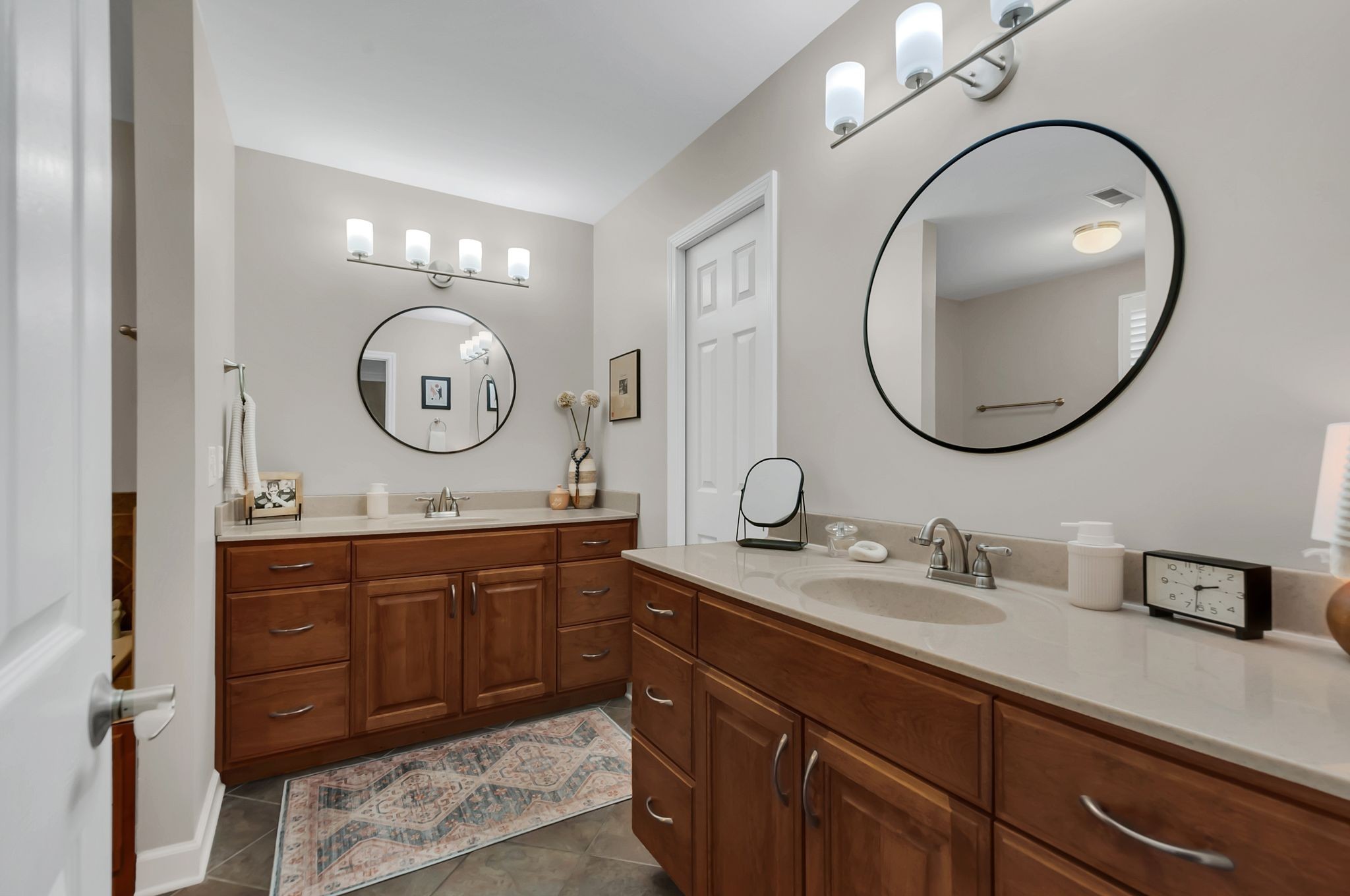 1343 General George Patton Road Nashville, TN 37221 - Photo 30 of 41 a bathroom with a double vanity sink and a mirror