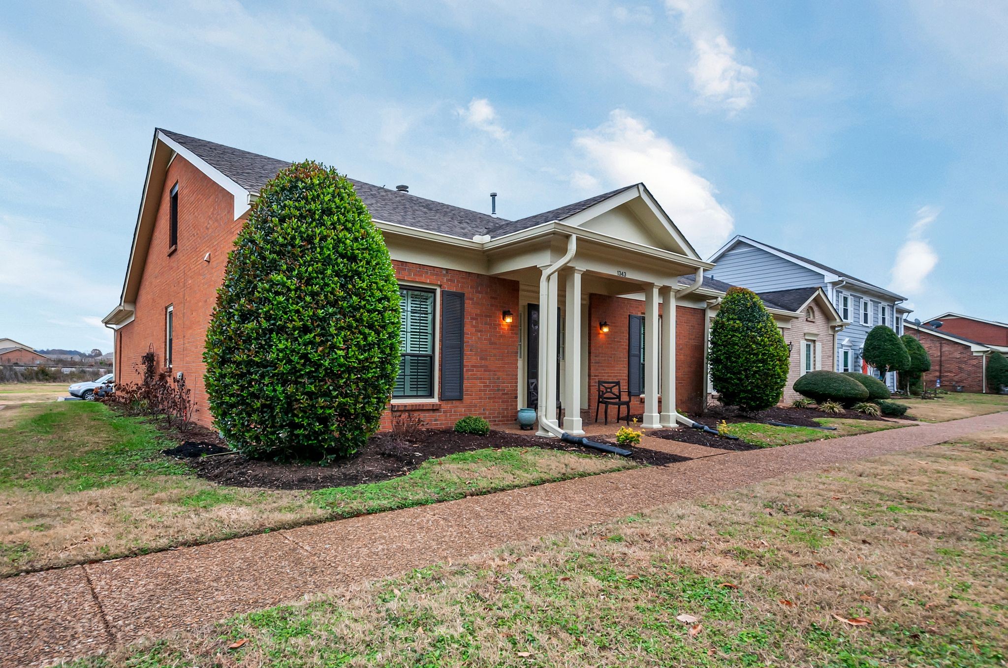 1343 General George Patton Road Nashville, TN 37221 - Photo 3 of 41 a front view of a house with garden