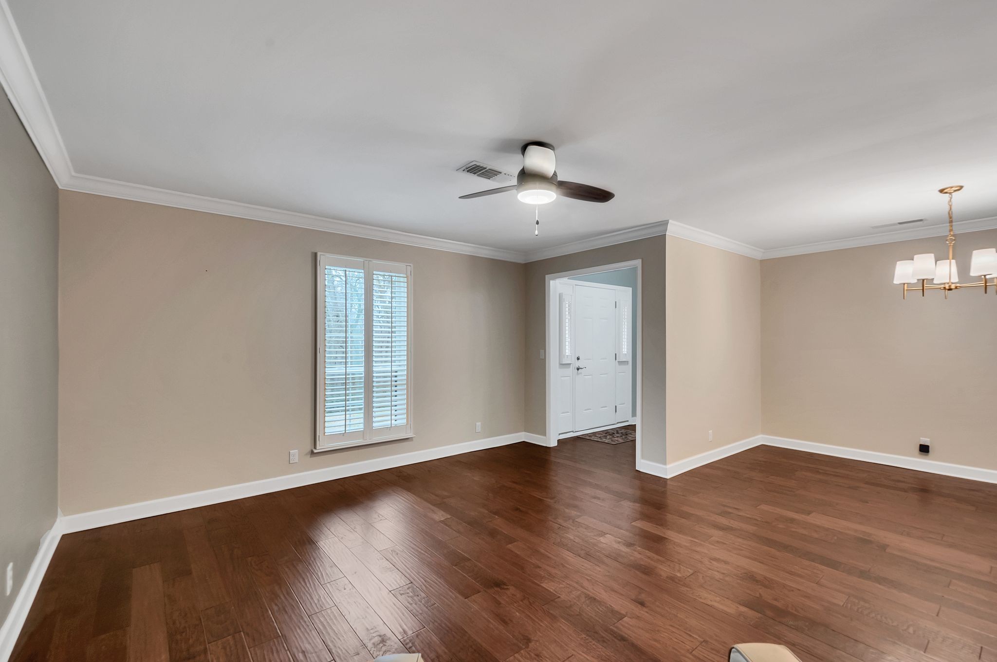 1343 General George Patton Road Nashville, TN 37221 - Photo 8 of 41 a view of an empty room with wooden floor and a window