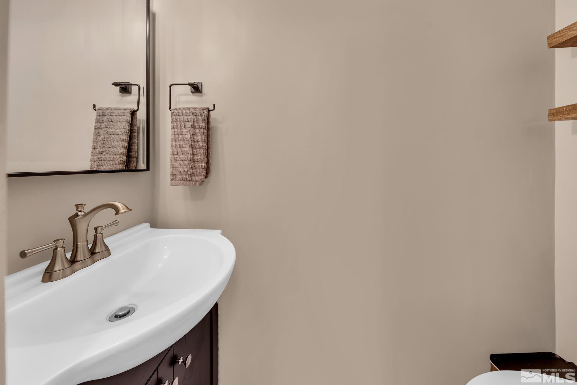 1830 West 7th Street Reno, NV 89503 - Photo 19 of 36 a bathroom with a sink and a mirror