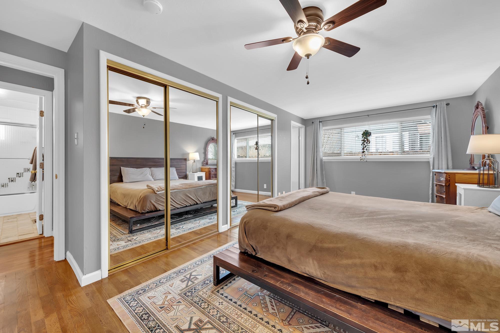 1830 West 7th Street Reno, NV 89503 - Photo 21 of 36 a bedroom with a bed and a chandelier