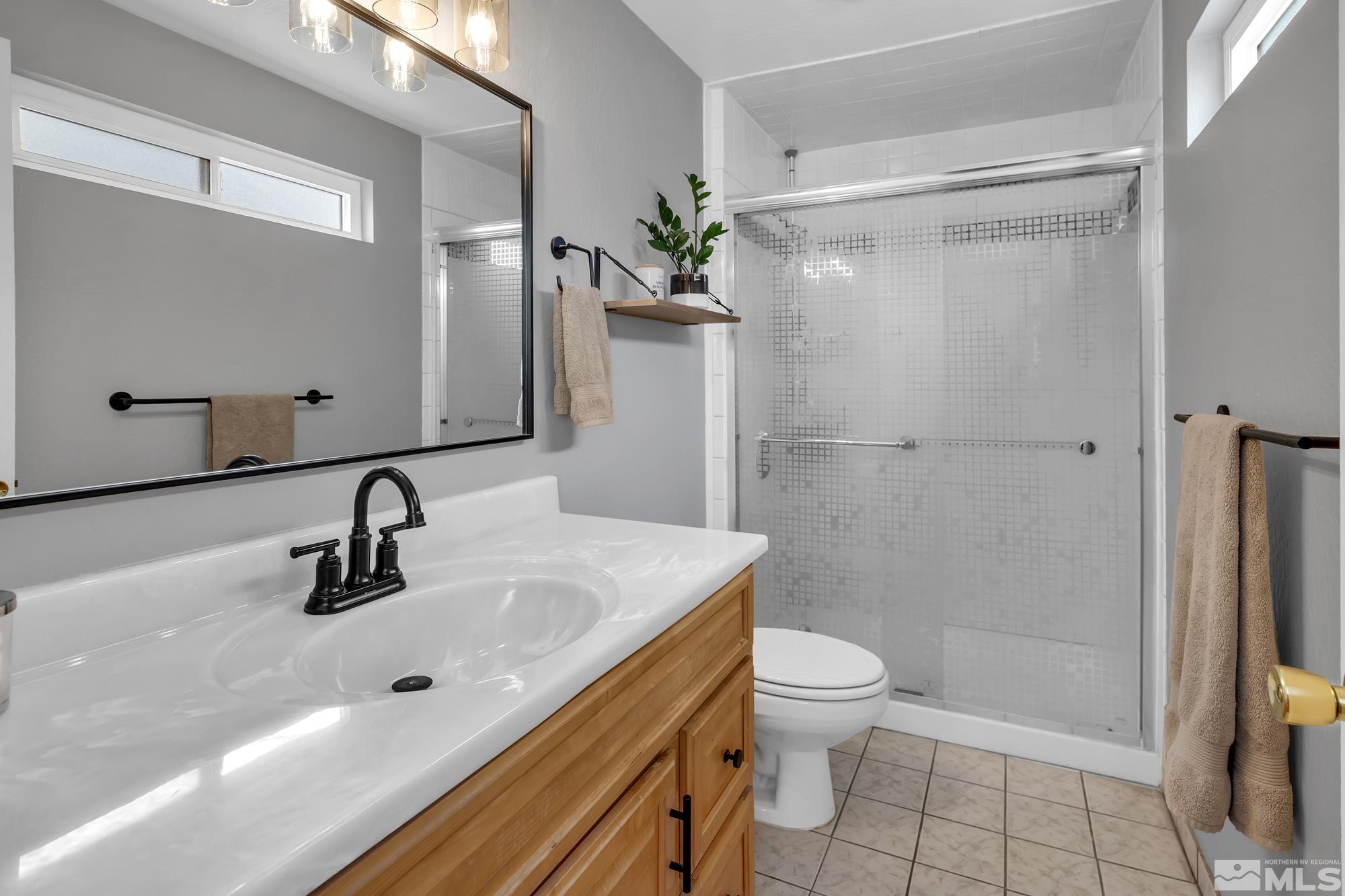 1830 West 7th Street Reno, NV 89503 - Photo 23 of 36 a bathroom with a sink a toilet and shower