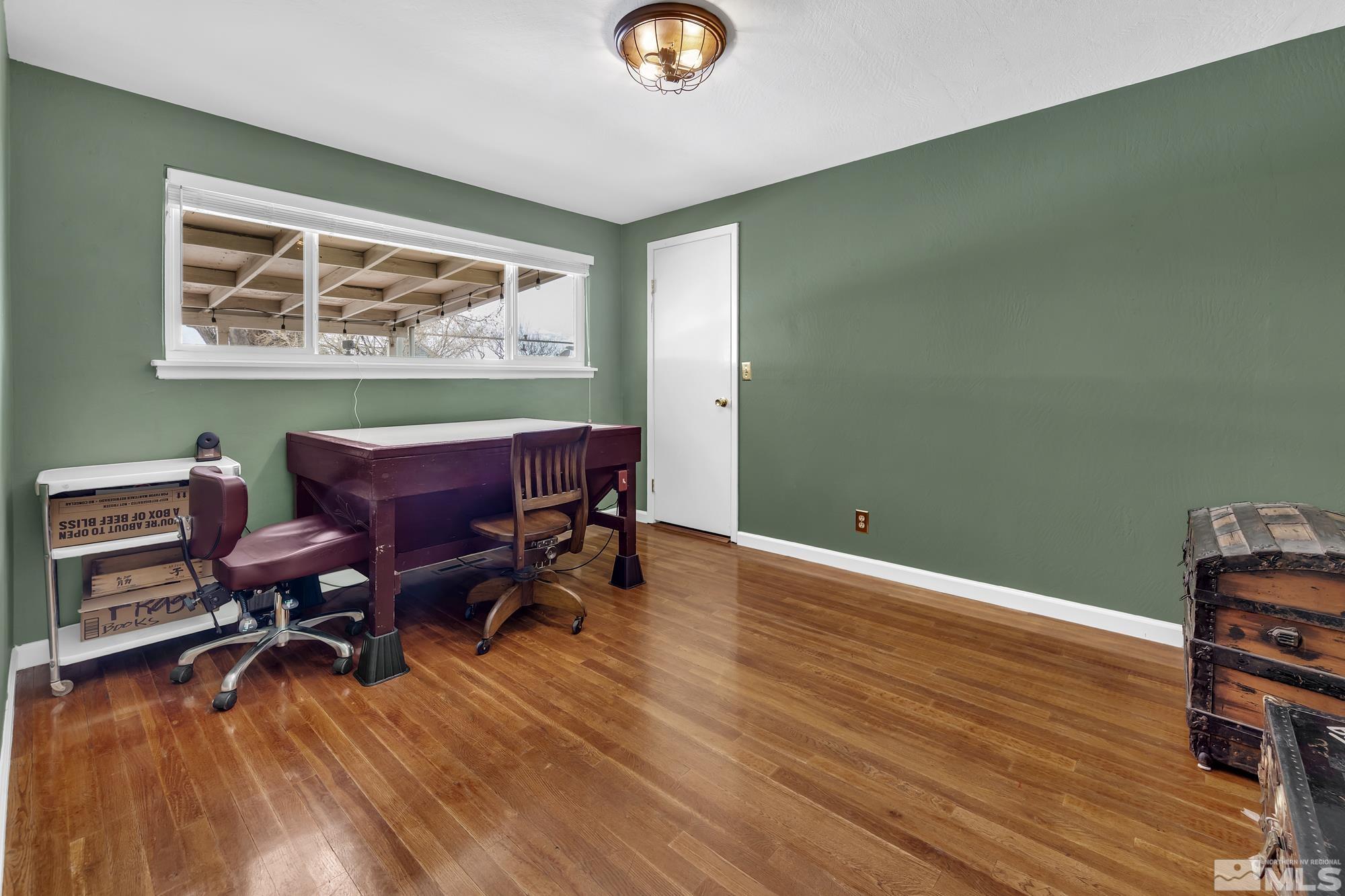 1830 West 7th Street Reno, NV 89503 - Photo 24 of 36 a view of a workspace with furniture and wooden floor