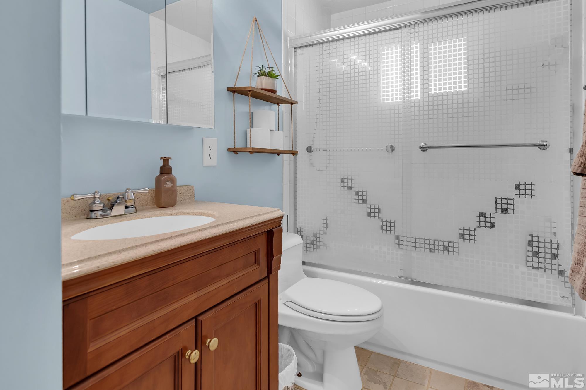 1830 West 7th Street Reno, NV 89503 - Photo 25 of 36 a bathroom with a sink a toilet and shower