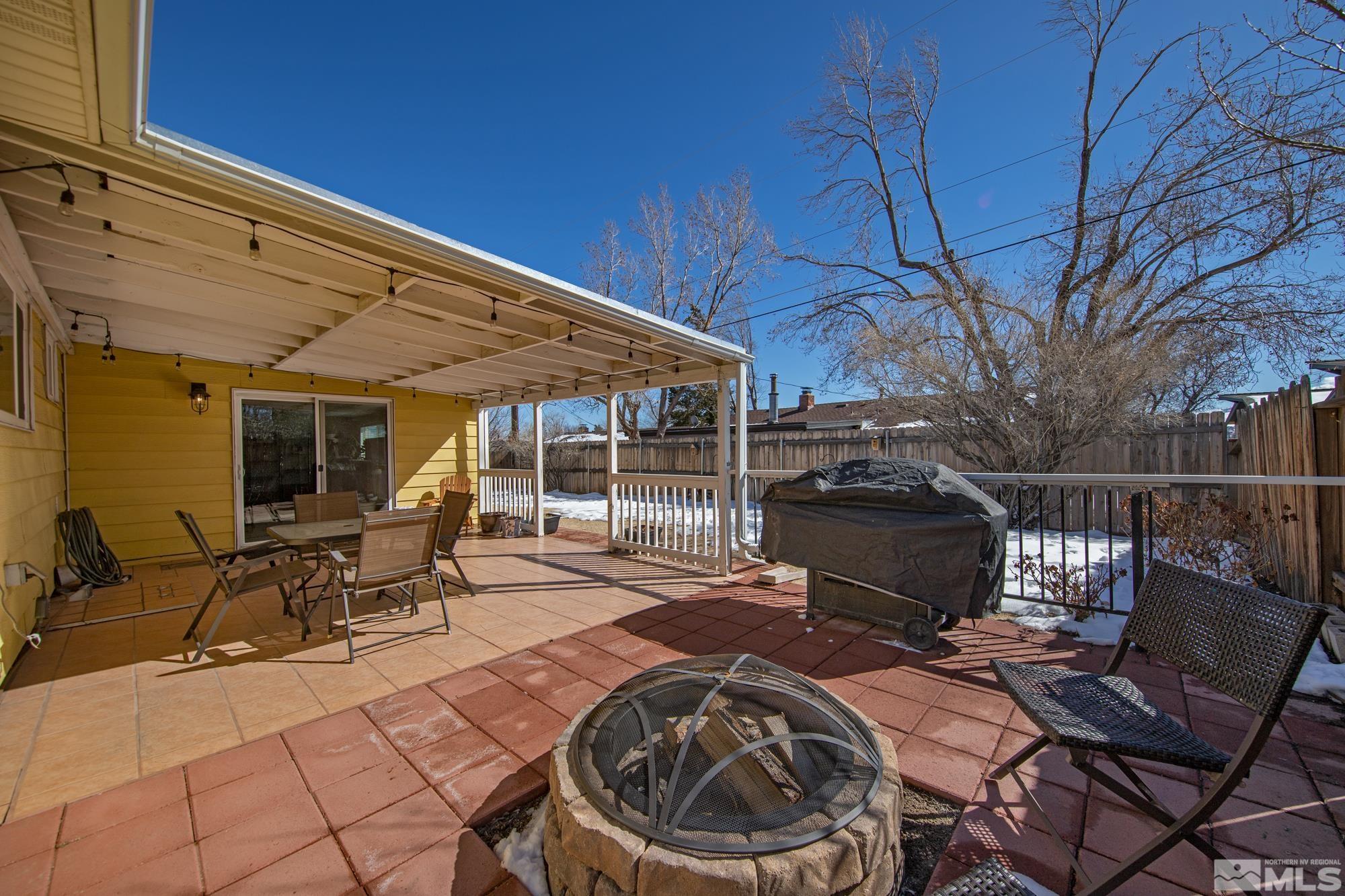 1830 West 7th Street Reno, NV 89503 - Photo 33 of 36 a view of a patio with table and chairs near a barbeque