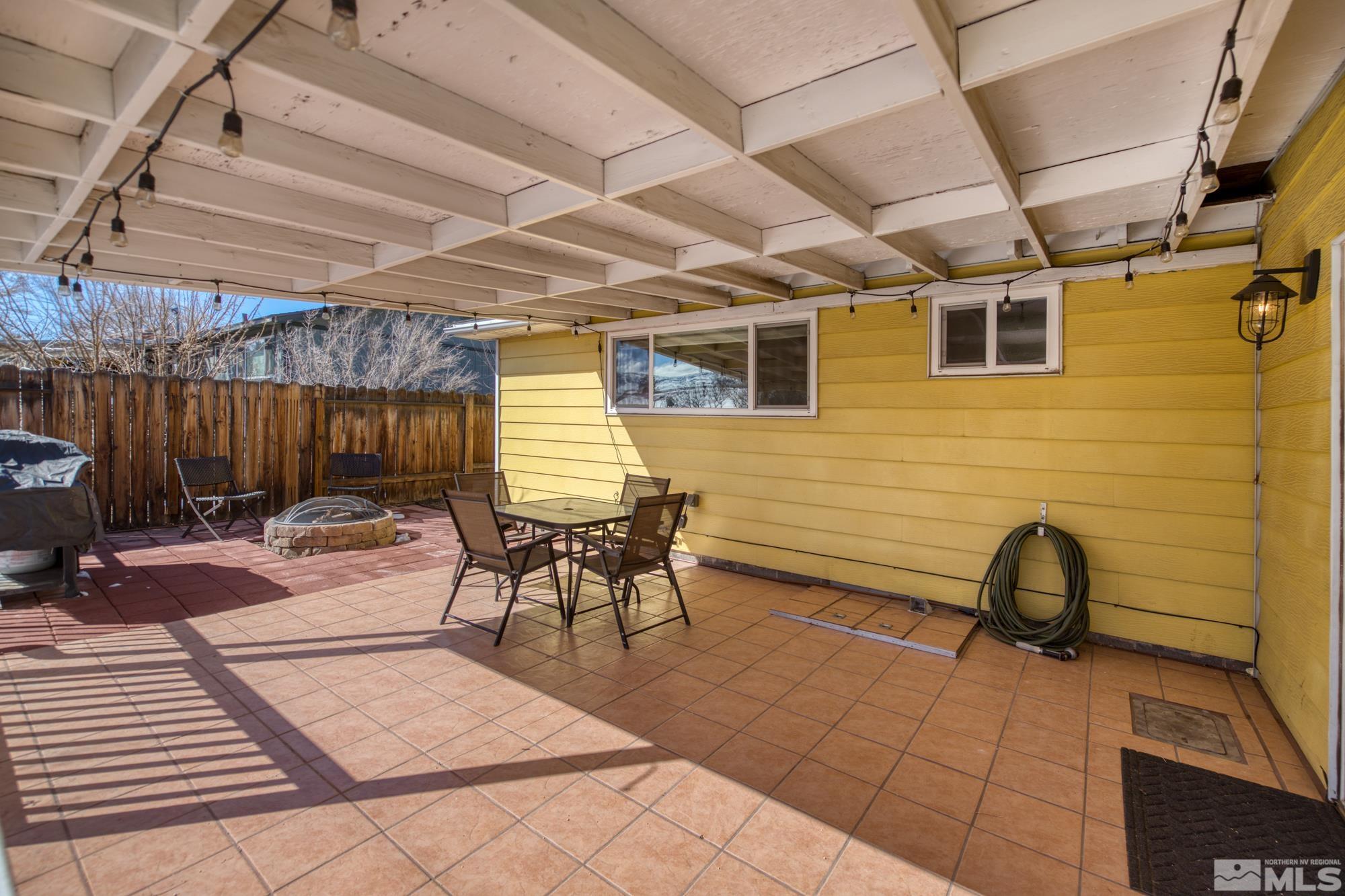 1830 West 7th Street Reno, NV 89503 - Photo 36 of 36 a view of a patio with table and chairs with wooden floor