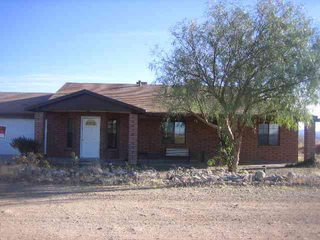317 Camino Arenosa Rio Rico, AZ 85648 - Photo 1 of 5 a front view of a house with a yard