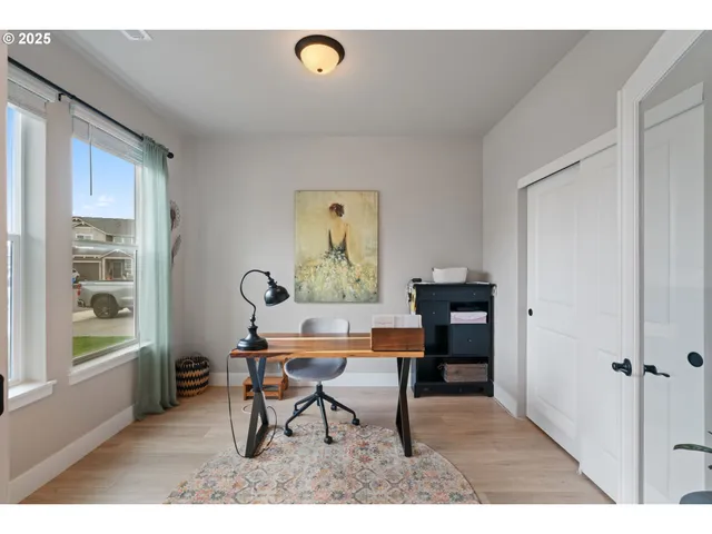 a workspace with furniture and window