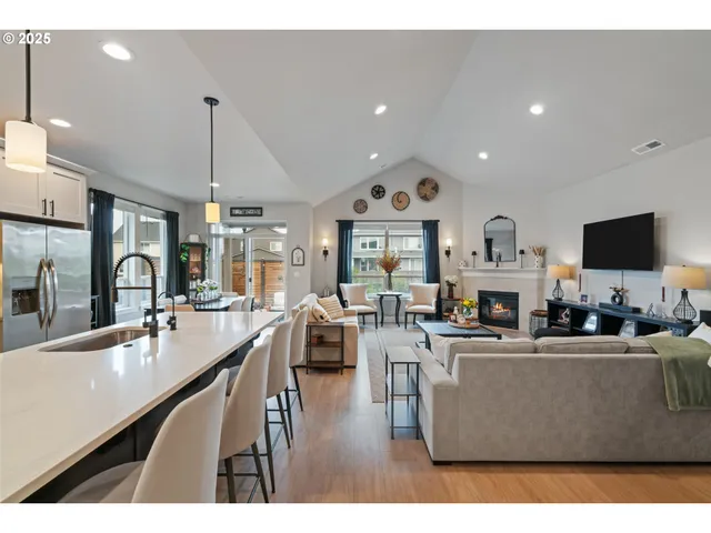 a living room with lots of furniture and a flat screen tv