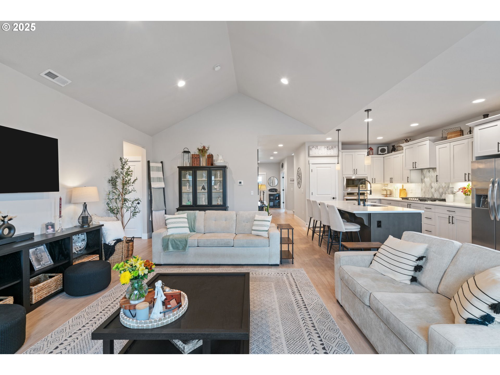 8842 North 3rd Circle Ridgefield, WA 98642 - Photo 18 of 46 a living room with furniture and a flat screen tv