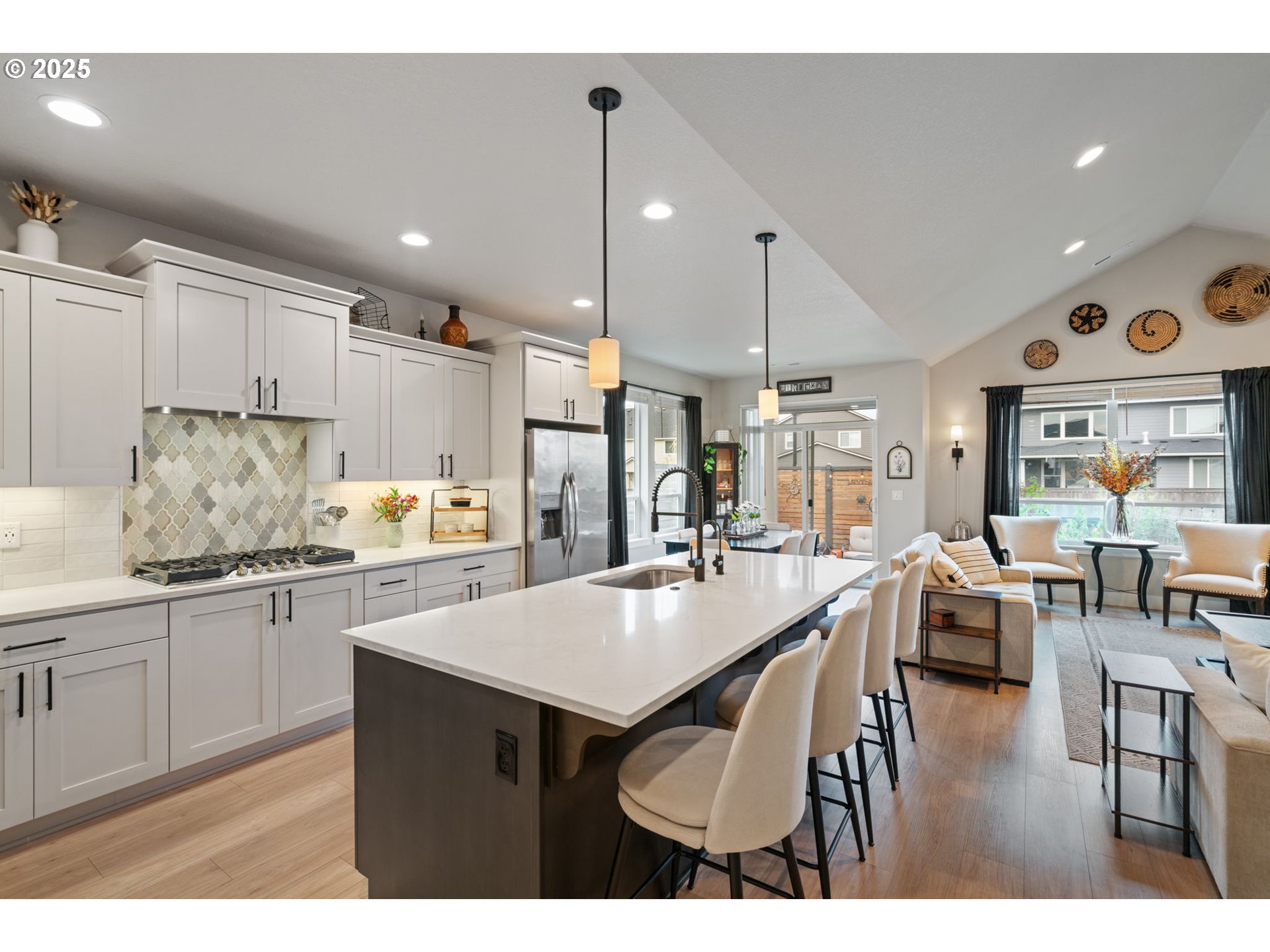 8842 North 3rd Circle Ridgefield, WA 98642 - Photo 19 of 46 a kitchen with stainless steel appliances granite countertop a stove refrigerator and cabinets