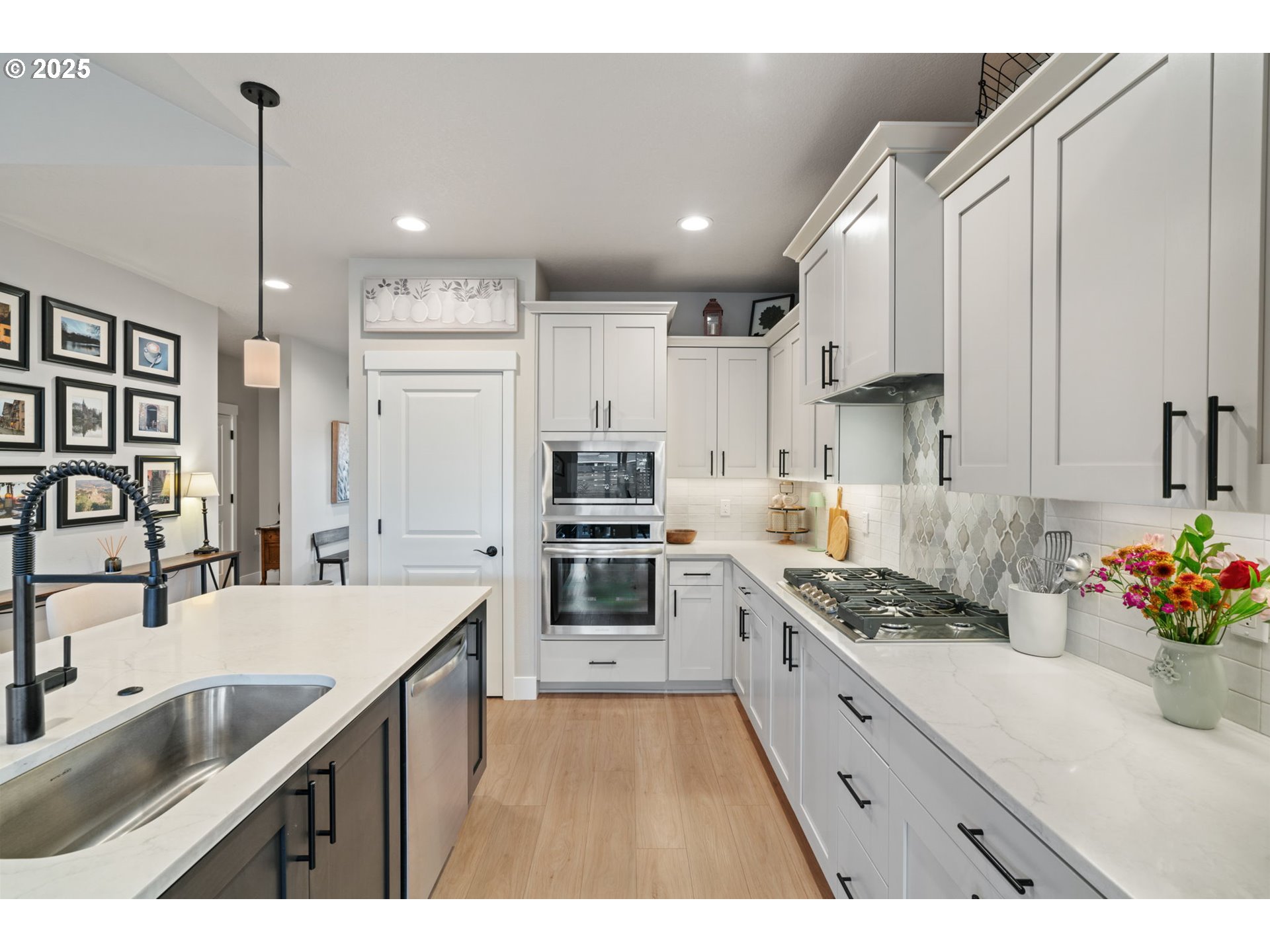 8842 North 3rd Circle Ridgefield, WA 98642 - Photo 23 of 46 a kitchen with stainless steel appliances kitchen island granite countertop a sink stove and cabinets