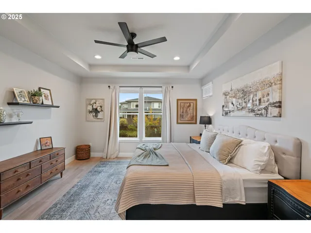 a bedroom with a large bed and a window