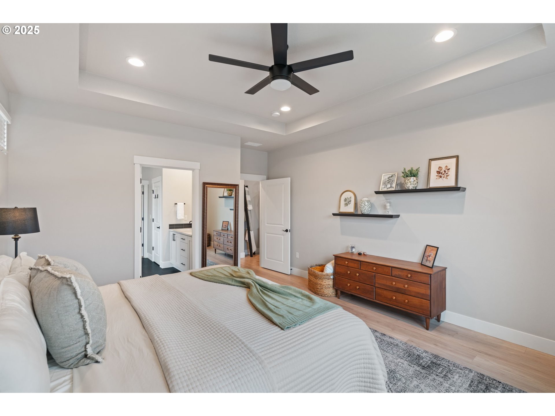 8842 North 3rd Circle Ridgefield, WA 98642 - Photo 28 of 46 a bedroom with a bed and a ceiling fan